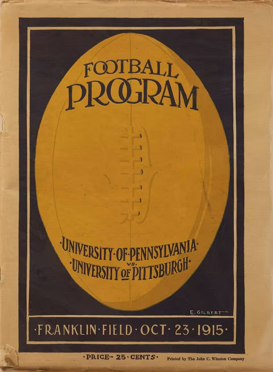 Vintage black and gold program cover with a large football depicted and verbiage of 1915 Penn versus Pitt football program cover E. Gilbert was the Illustrator