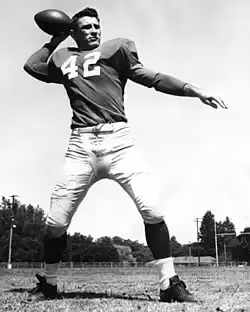 Publicity b/w pose throwing a football of number 42, Charlie Conerly with the New York Giants in 1948, courtesy of a generous Wikimedia Commons uploader.