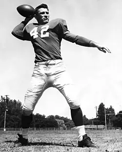 Publicity b/w pose throwing a football of number 42, Charlie Conerly with the New York Giants in 1948, courtesy of a generous Wikimedia Commons uploader.
