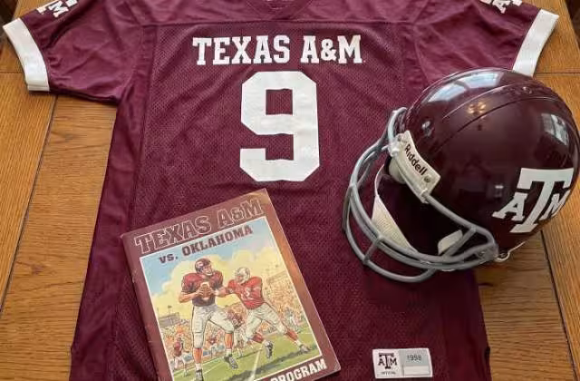 Gemini AI-created image of a 1998-era Texas A&M American football jersey 9, without a name on it, and a matching period-correct helmet, the program cover appropriate to the era and team.