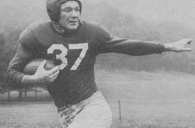B/W vintage publicity posed photo of George Franck (1918–2011), back for the New York Giants of the National Football League, 1947. Photographer uncredited. Published in Walter Collier (ed.), Redskin Review: The Redskins vs. New York Giants, Griffith Stadium, Washington, DC, Oct. 12, 1947; p. 23.