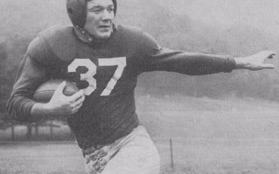B/W vintage publicity posed photo of George Franck (1918–2011), back for the New York Giants of the National Football League, 1947. Photographer uncredited. Published in Walter Collier (ed.), Redskin Review: The Redskins vs. New York Giants, Griffith Stadium, Washington, DC, Oct. 12, 1947; p. 23.