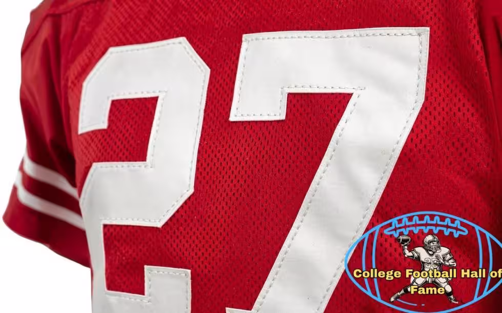 Canva AI-created of a red Ohio State jersey from the Era of Eddie George, number 27 with a Pigskin Dispatch College Football HOF seal.