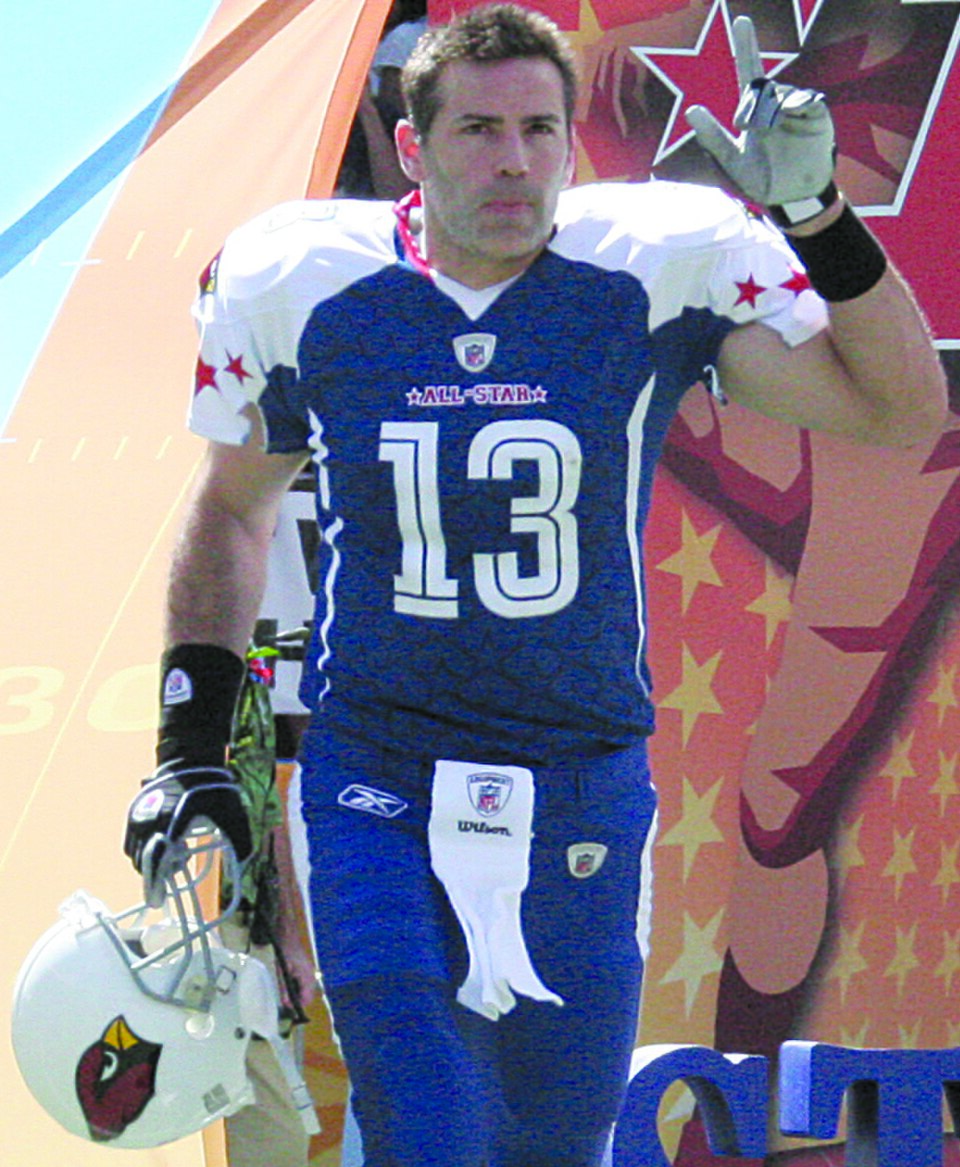 Kurt Warner waves to the 50,000 in attendance at the NFL Pro Bowl Sunday as he and the rest of the NFC Champion Arizona Cardinals were introduced. Warner was the starting quaterback for the NFC team.