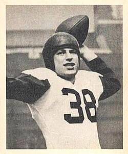 b/W publicity image of Minisi on a 1948 Bowman football card, throwing a football.