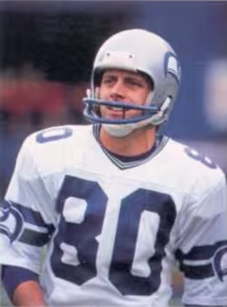 Color game day image of 1985 card of Steve Largent for Seattle Seahawks.