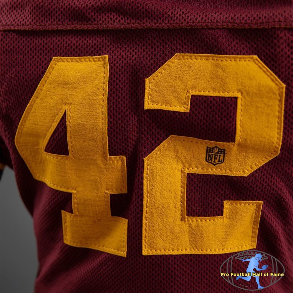 Dark red American football jersey with yellow "42" on it
