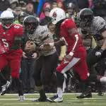 full color game action shot in 2014, A football game between Army and Ball State in 2014. Taken by John Pellino via Wikimedia Commons.