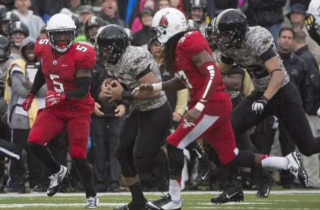 full color game action shot in 2014, A football game between Army and Ball State in 2014. Taken by John Pellino via Wikimedia Commons.