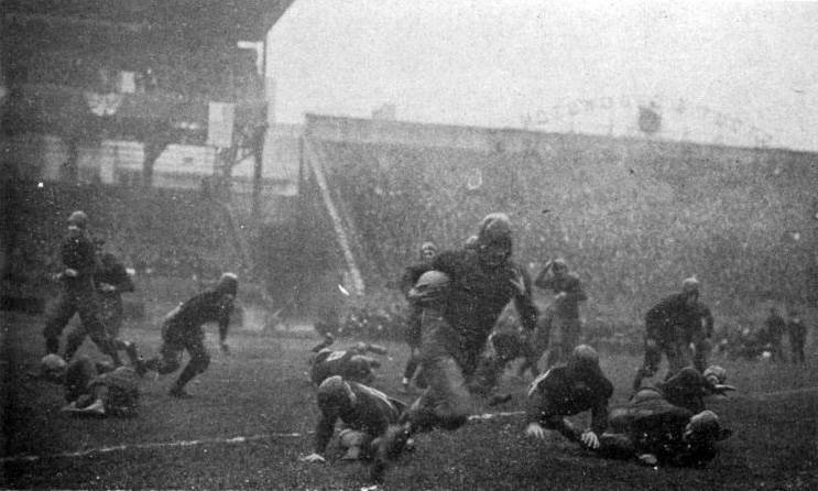 Pitt's Tommy Davies runs against undefeated and unscored upon Georgia Tech in a 1918 game at Forbes Field. Pitt won the game 32β0 and is considered by many to be that season's national champion.