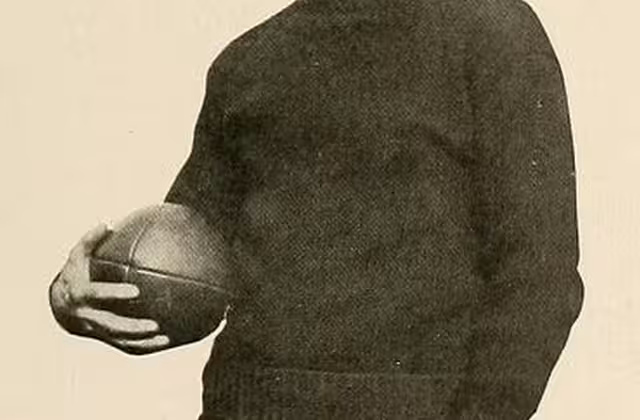 Vintage black and white publicity image of Coach Leroy Mercer pictured in Halcyon 1918, Swarthmore yearbook, released into the public domain, uploaded to Wikimedia Commons by a contributor.