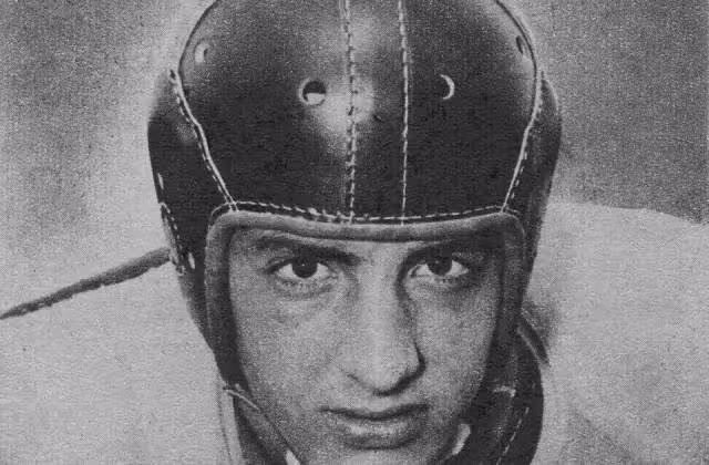 Cropped b/w head shot publicity image of George while at Wake Forest, 1949, wearing a leather helmet of the era.