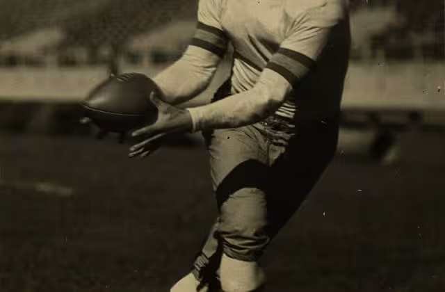Vintage b/w image of Football player Sid Gillman in 1935. Sidney Gillman, OSU football player 1931-1933 and assistant OSU football coach 1934, 1938-1940. He later coached at Miami, University of Cincinnati, and was head coach of the San Diego Chargers. He was inducted into the College Football Hall of Fame in 1989 and the Pro Football Hall of Fame in 1983.