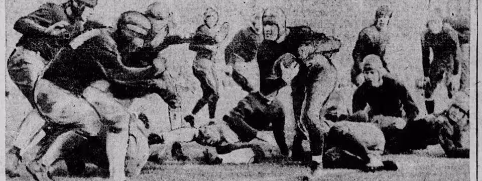 Vintage b/w newspaper image of Harry Stuhldreher carries ball against Stanford in Rose Bowl, Jan. 1, 1925.jpg Caption text says "Harry Stuhldreher, Notre Dame quarterback and all-American in the position on most of the team picked by the critics, is shown here carrying the ball in the New Year's day game between Notre Dame and Stanford in the Rose bowl at Pasadena, Cal. Evidently he did not gallop far as his foot slipped out of bounds as the photo was snapped and as three husky Cardinals (at the left) charged him. Apparently it was an out-of-bounds play by Notre Dame, so that the latter could get the ball fifteen yards from the sideline." The Des Moines Register