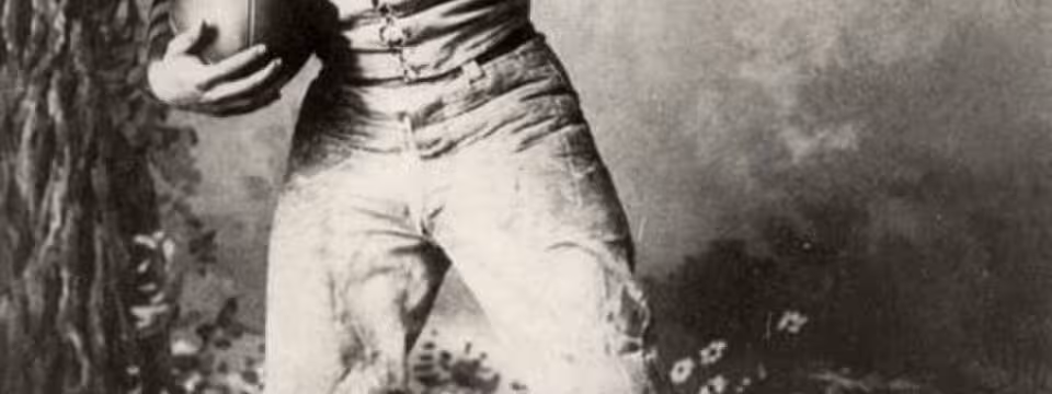 John Heisman posing as football player while at Penn, 1891.