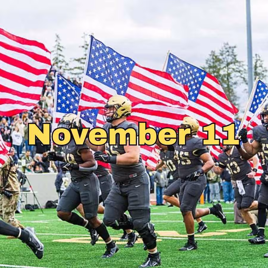2023 Army Black Knights taking the field as American Flags wave.