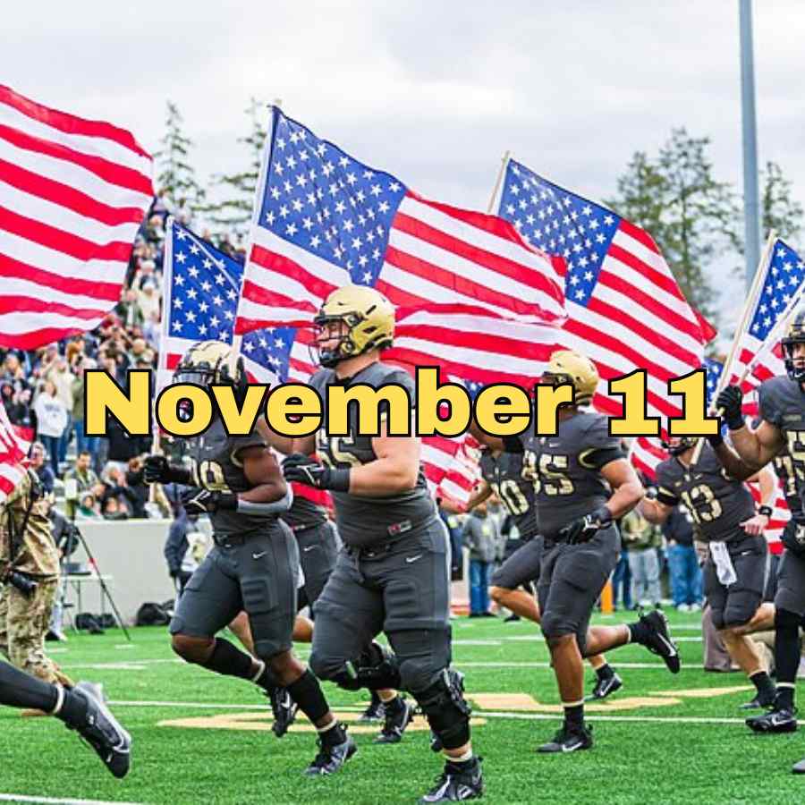 2023 Army Black Knights taking the field as American Flags wave.