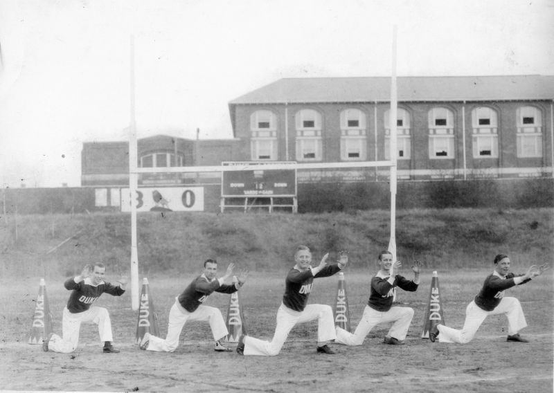 image of male Duke cheerleaders kneeling from 1924