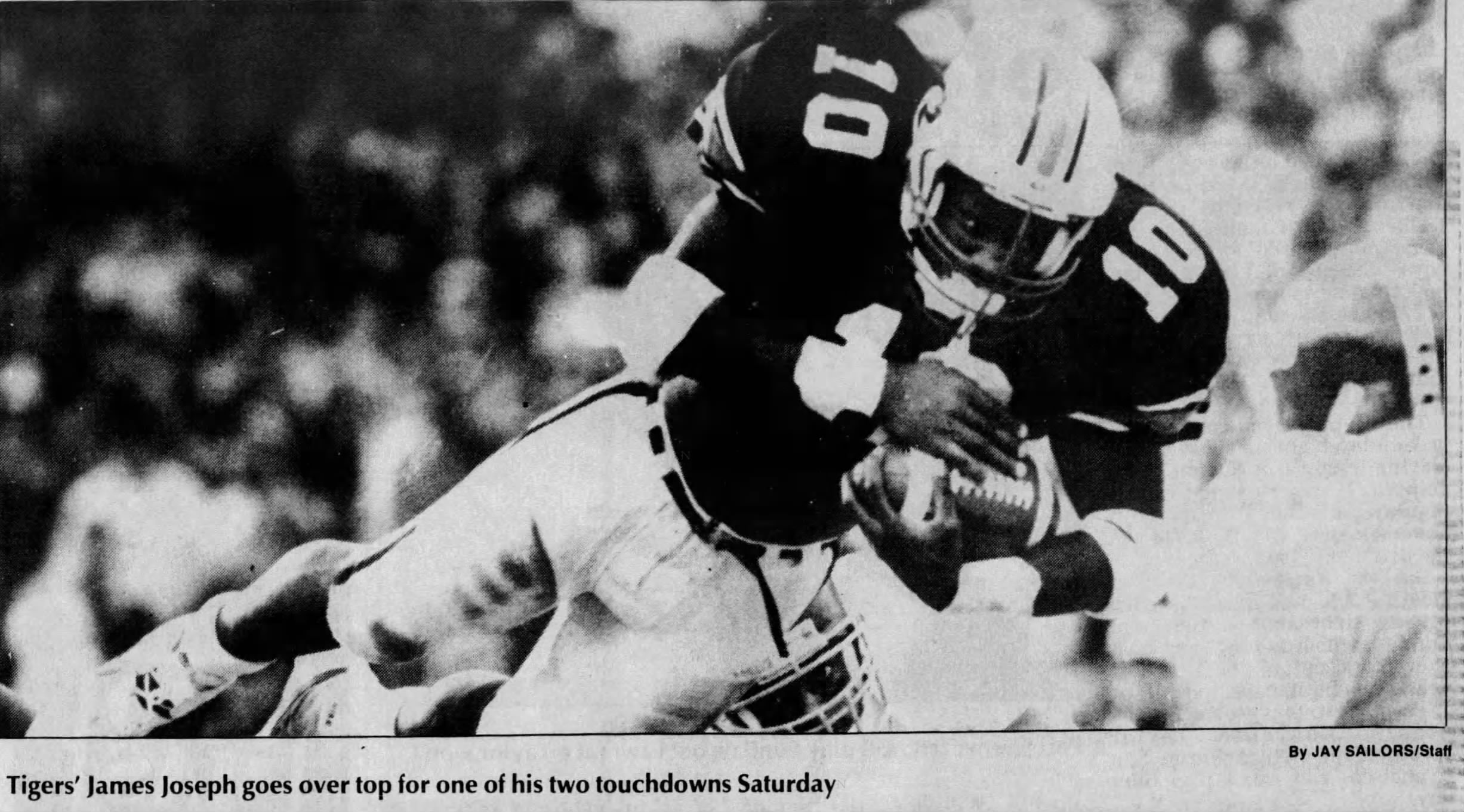 News clipping of Auburn RB diving for a TD