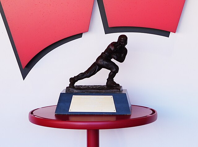 A photograph of the 1999 Heisman Memorial Trophy awarded to <a rel=