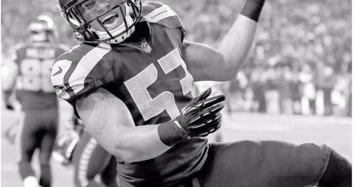 b/w newspaper image of Seattle's Malcolm Smith celebrating