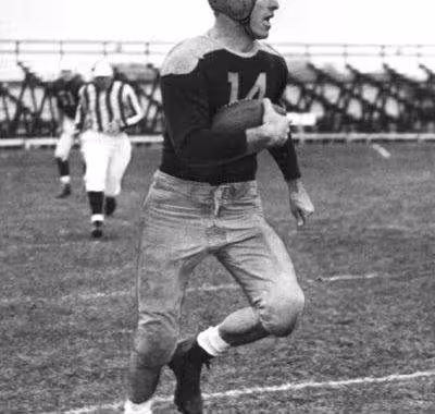 black and white full body action shot of Green Bay end Don Hutson, 1935-39