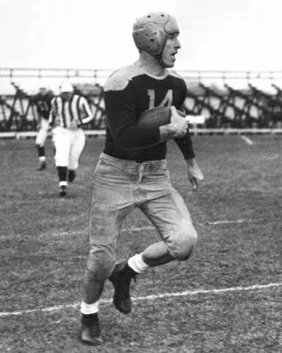black and white full body action shot of Green Bay end Don Hutson, 1935-39