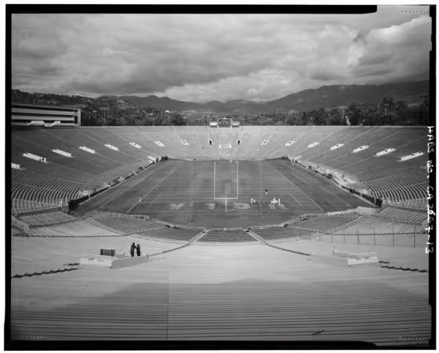 black and white old end zone view photo of the Rose Bowl Stadium looking at the St Gabriel Mountains on the horizon