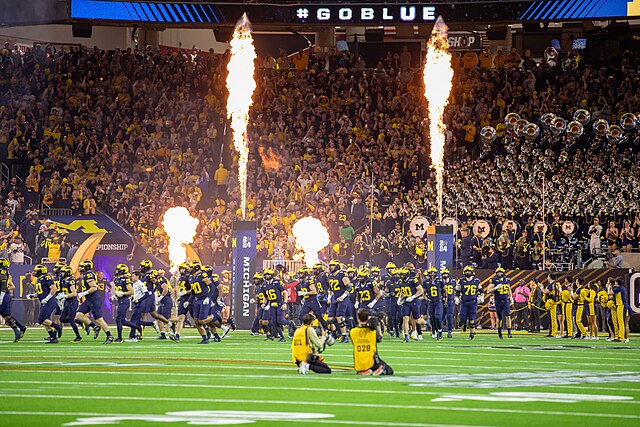 fireworks entrance of an American football team at a bowl game