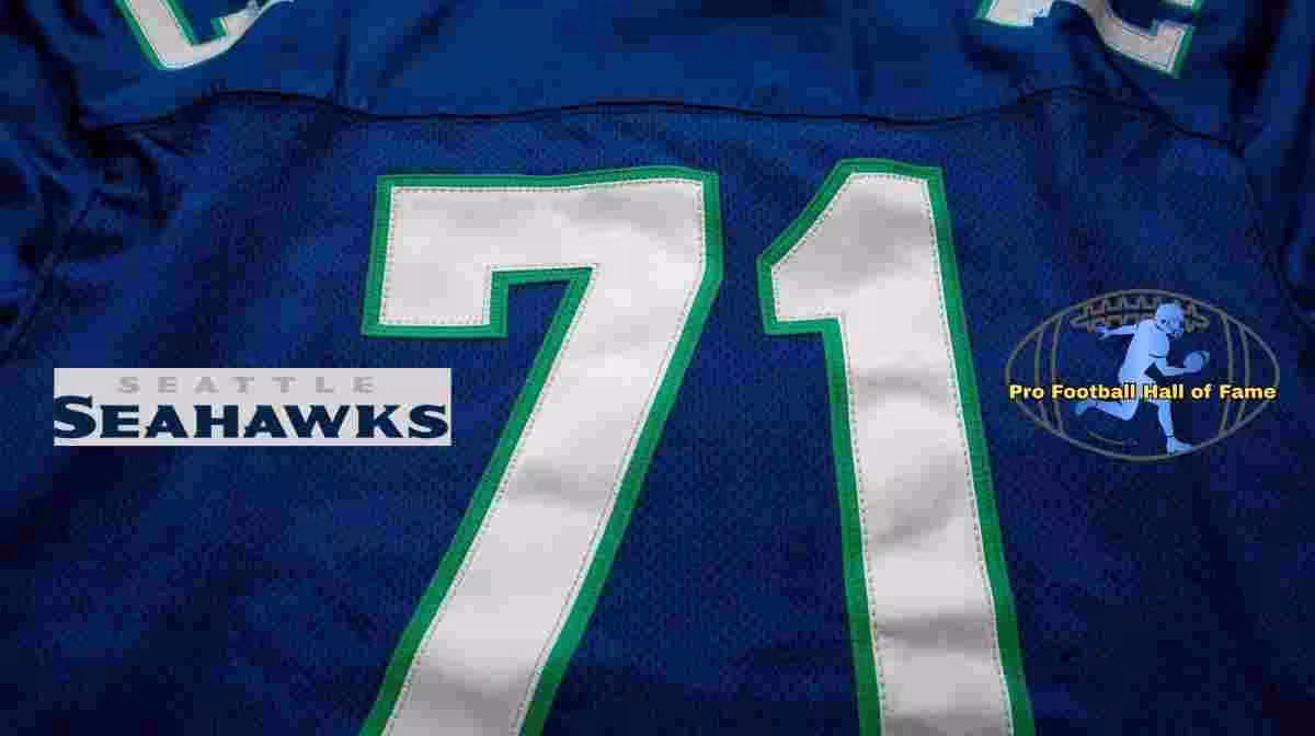 Image of a blue with white numerals Seattle football Jersey number 71 and Seahawks word art logo rendering with PD Pro football HOF emblem.