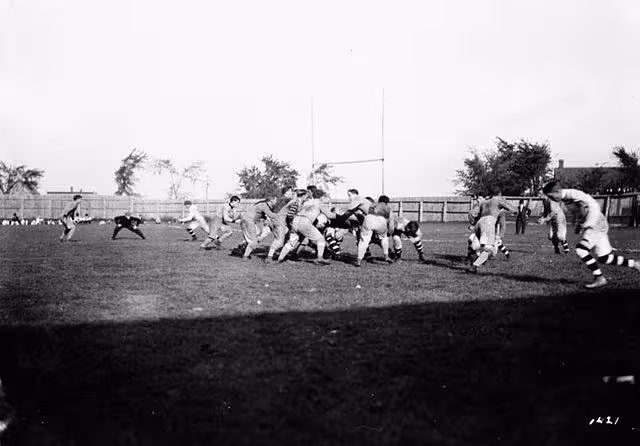 black and white game action photo of August 1910, Ottawa and Hamilton Tigers football game.