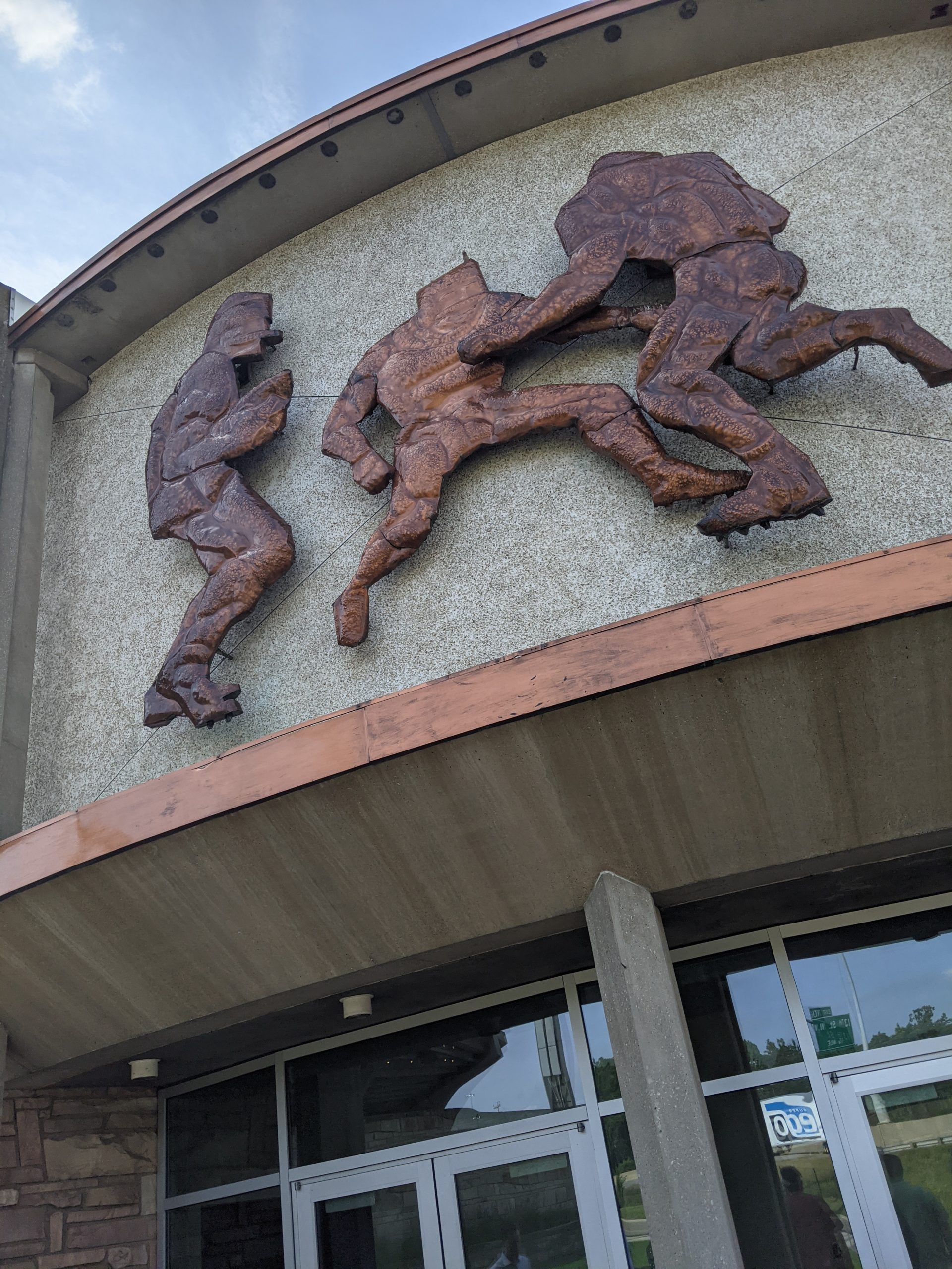 a photo of the art work on the outsodfe of the Pro Football Hall of Fame rotunda