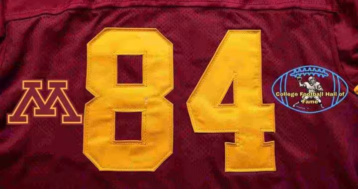 Image of a red with gold numerals football Minnesota Jersey number 84 rendering with PD College football HOF emblem.