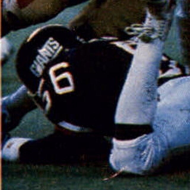 New York Giants linebacker Lawrence Taylor in his blue number 56 jersey pictured in a defensive play against the San Francisco 49ers