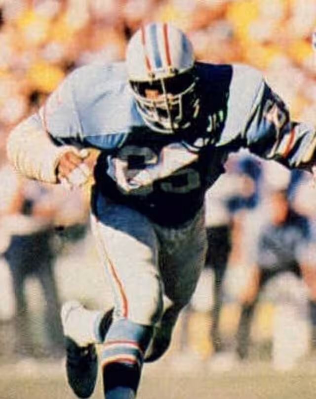 color image of Houston Oilers defensive end Elvin Bethea in a defensive play