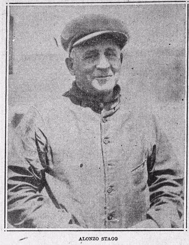 black and white 1928 photograph of Chicago Maroons football coach Alonzo Stagg in a longsleeve button down jacket and a cap with hands in his jacket pocket