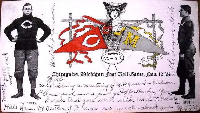 a semi colored image of Souvenir postcard from the 1904 Chicago–Michigan football rivalry game. A color pennant of each school is bordered by black and white full body images of Captain Speik and Capt. Heston