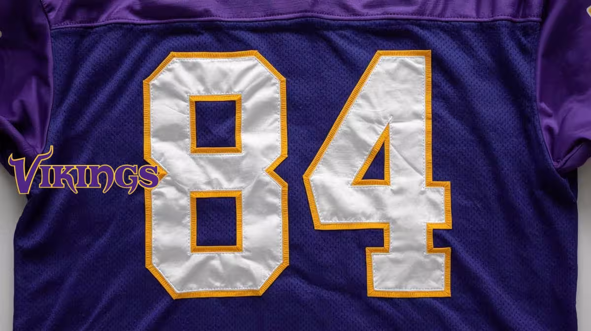 Image of a purple with white numerals football Jersey number 84 rendering.