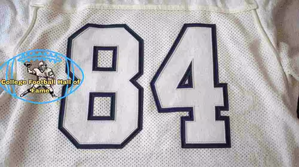 Image of a white with black outlined white numerals football Jersey number 84 rendering with PD College football HOF emblem.