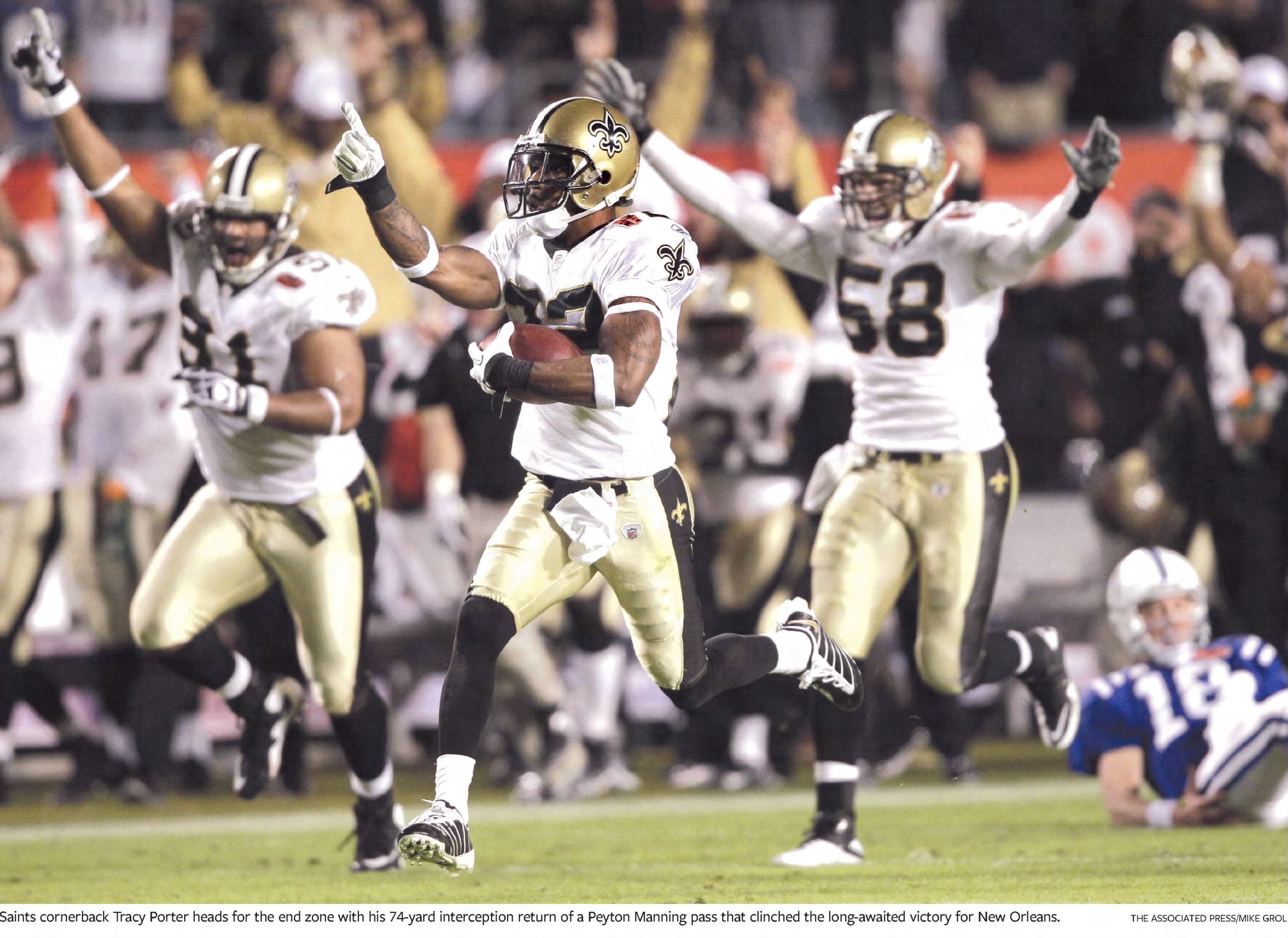 Color AP image of New Orleans Saints players celebrating as they score a TD in Super Bowl XLIV
