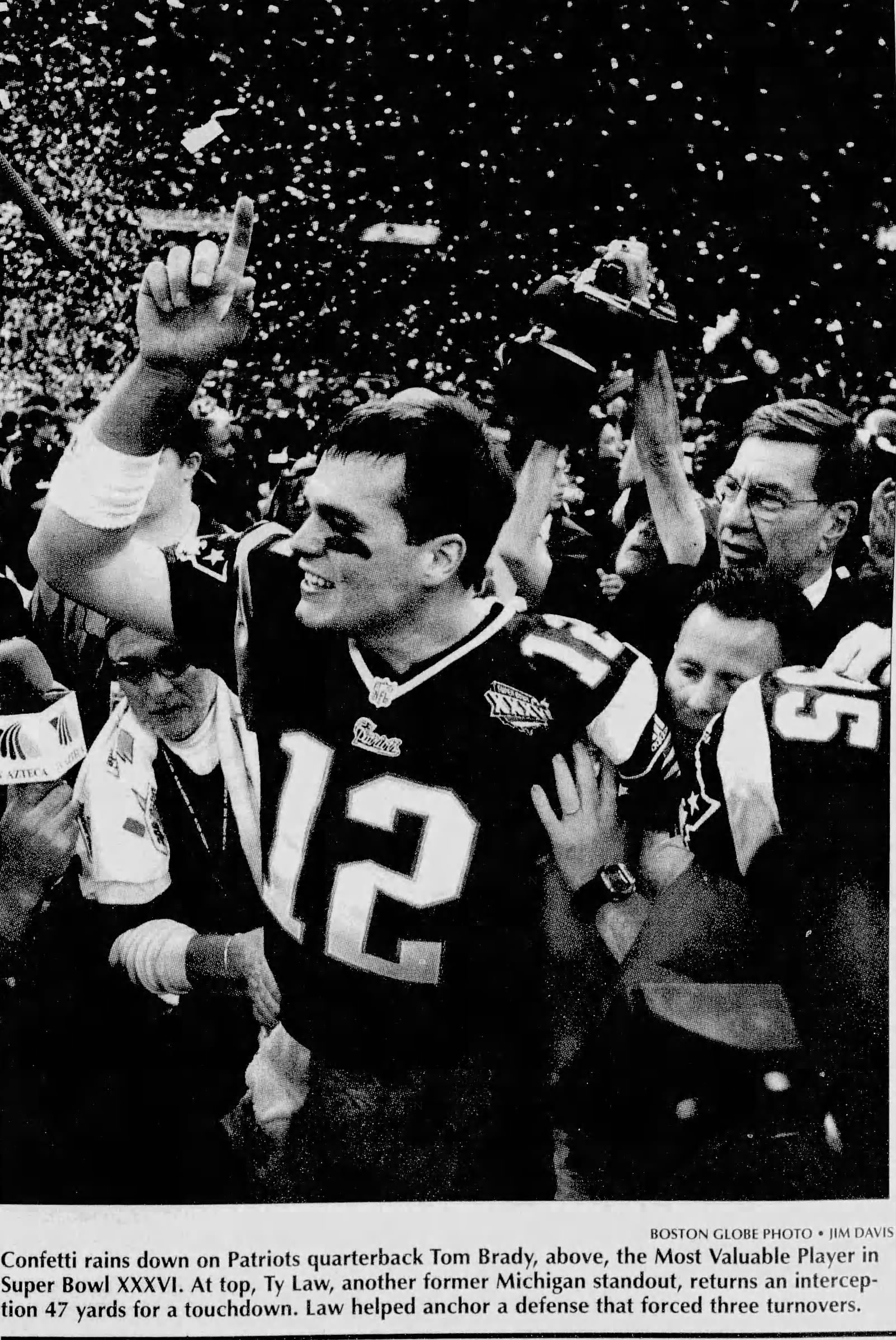 A black and white newspaper image (Boston Globe) of Tom Brady after winning Super Bowl XXXVI