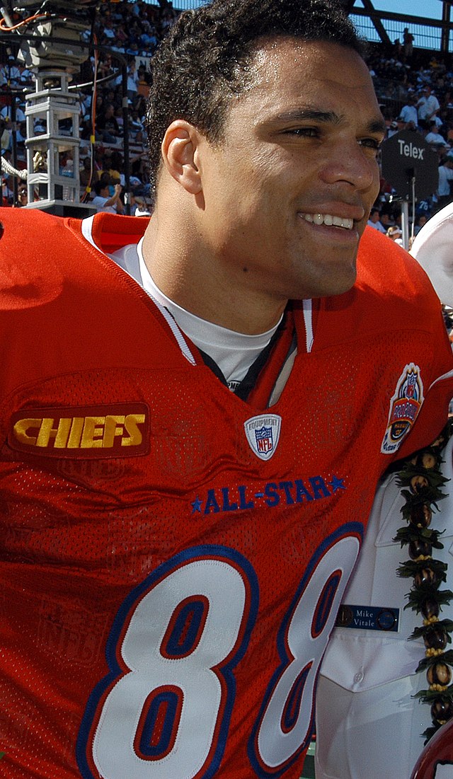 color image if Tony Gonzalex=z with his helmet off but in read jersey and football gear at the 2005 Pro Bowl