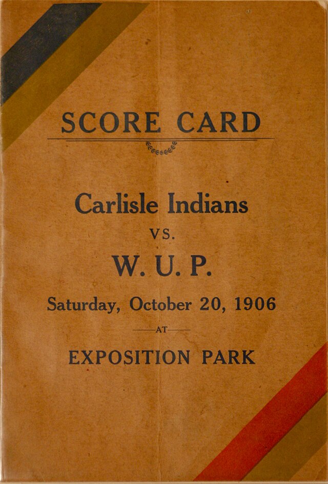 scorecard cover, manilla paper with red, gold and bllack stripes at opposite corners and the prominent type set of "Score Card, Carlisle vs W.U.P."