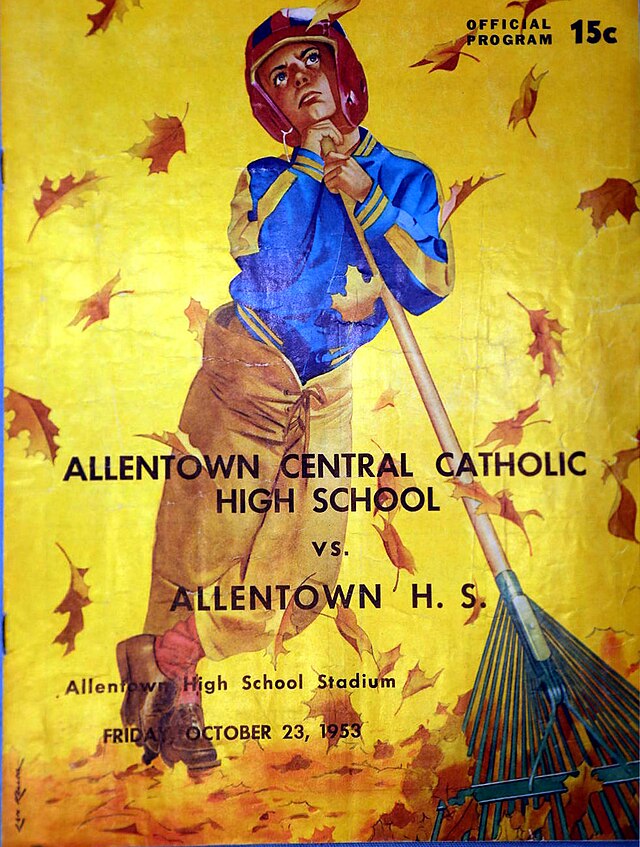 The front cover of the official October 23, 1953, football program for the Allentown Central Catholic High School vs. Allentown H.S. game. The yellow cover features a color illustration of a young boy in a maroon-and-gold striped helmet and a blue-and-gold jacket leaning on a leaf rake. He is looking upward as autumn leaves fall around him. The game was played at Allentown High School Stadium, with a listed price of 15 cents.