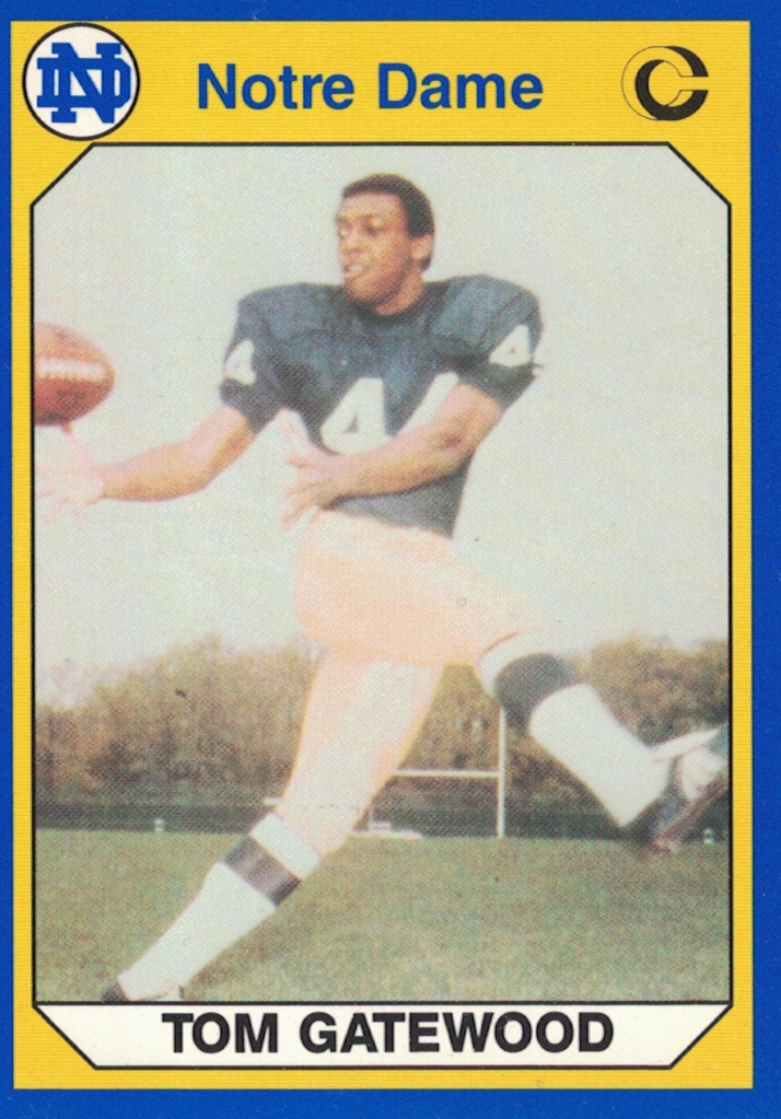 1990 ND football card depicting player number 44 posing to catch a pass, wearing a dark blue jersey, tan pants, and no helmet