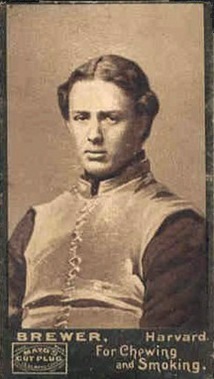 A vintage black-and-white studio portrait of Charley Brewer, a Hall of Fame football player for Harvard in the 1890s. He is shown from the chest up, wearing a dark, quilted canvas football vest of the era, looking directly at the camera with a serious expression.