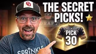 A YouTube thumbnail for a football draft video. On the left, Ed Kleese wears an Oklahoma Sooners hat and glasses, pointing with a surprised expression toward the right. Large bold text at the top reads 'THE SECRET PICKS!' with a gold star. To the right, a glowing navy blue and orange football jersey is displayed with the text 'PICK 30' overlaid on it. The background features a blurred NFL Draft stage.