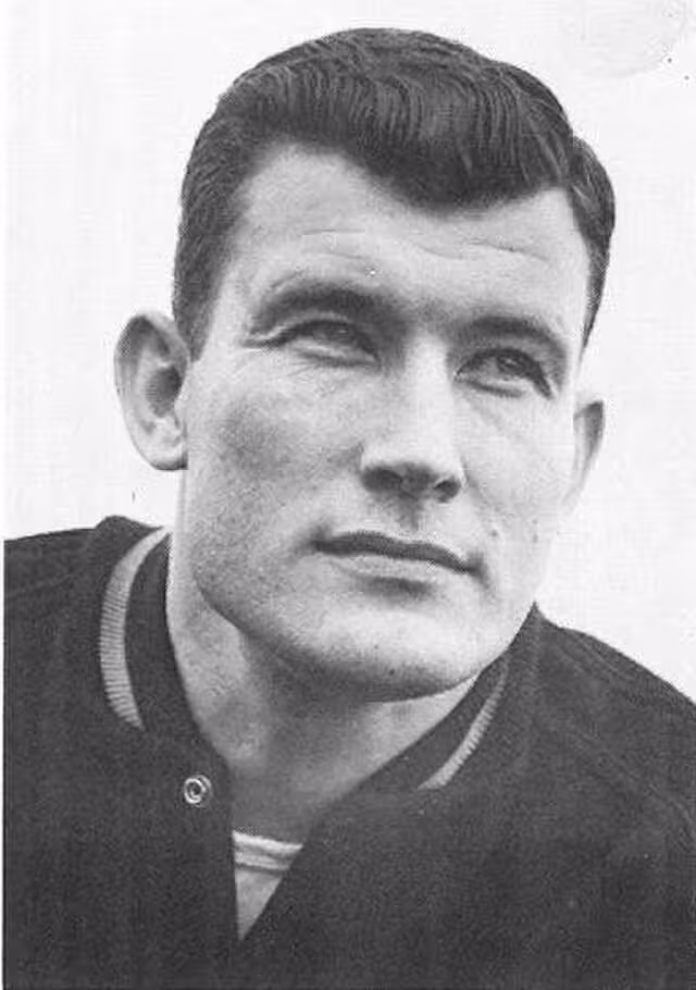 head shot image of Washington Husky coach Jim Owens in 1955