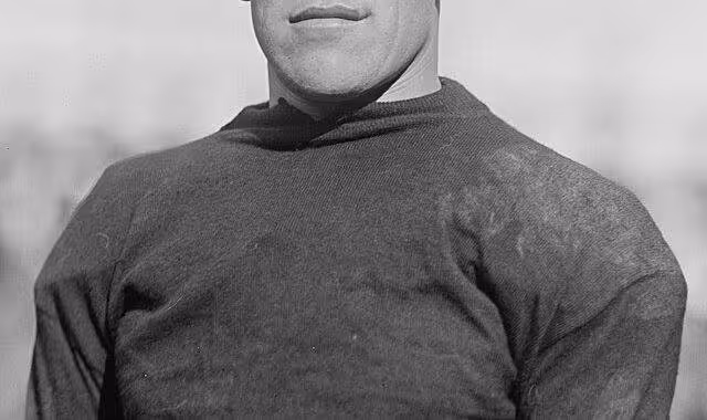 upper torso image of Jim Thorpe posing in his football gear 1915
