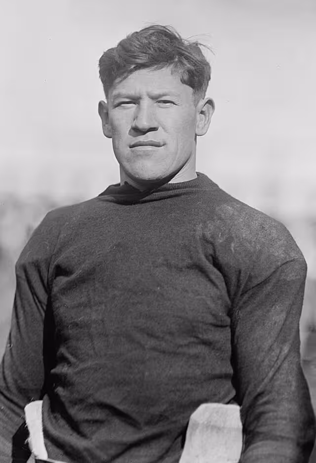 upper torso image of Jim Thorpe posing in his football gear 1915